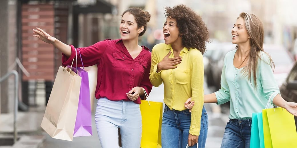 Customers looking in shop window