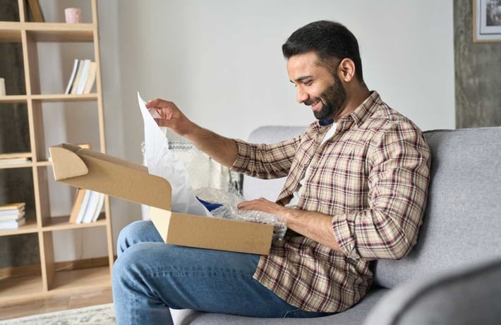 Excited customer opening delivery